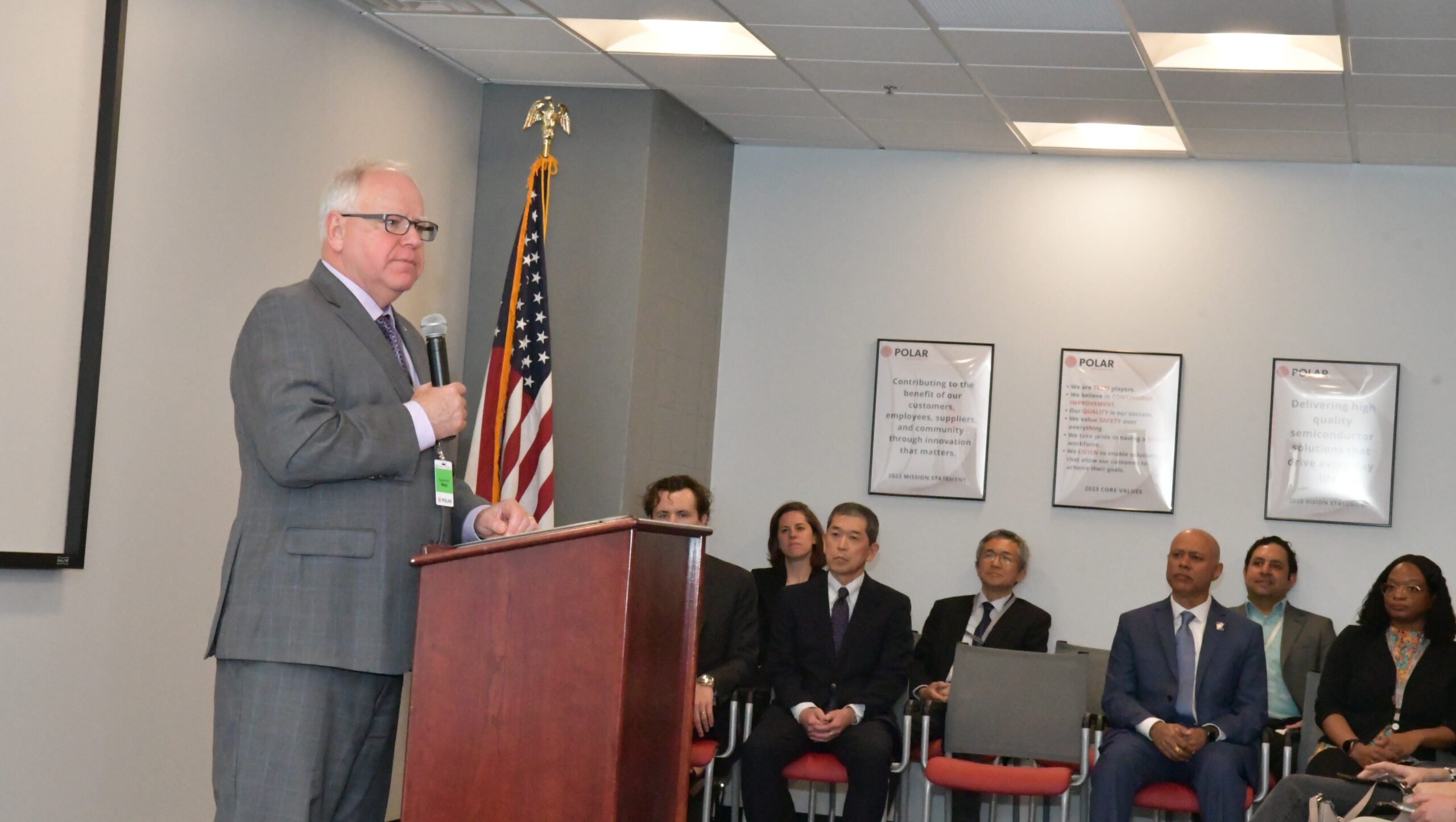 Governor Tim Walz addressing a crowd at Polar Semiconductor in Bloomington during a recent FOA event