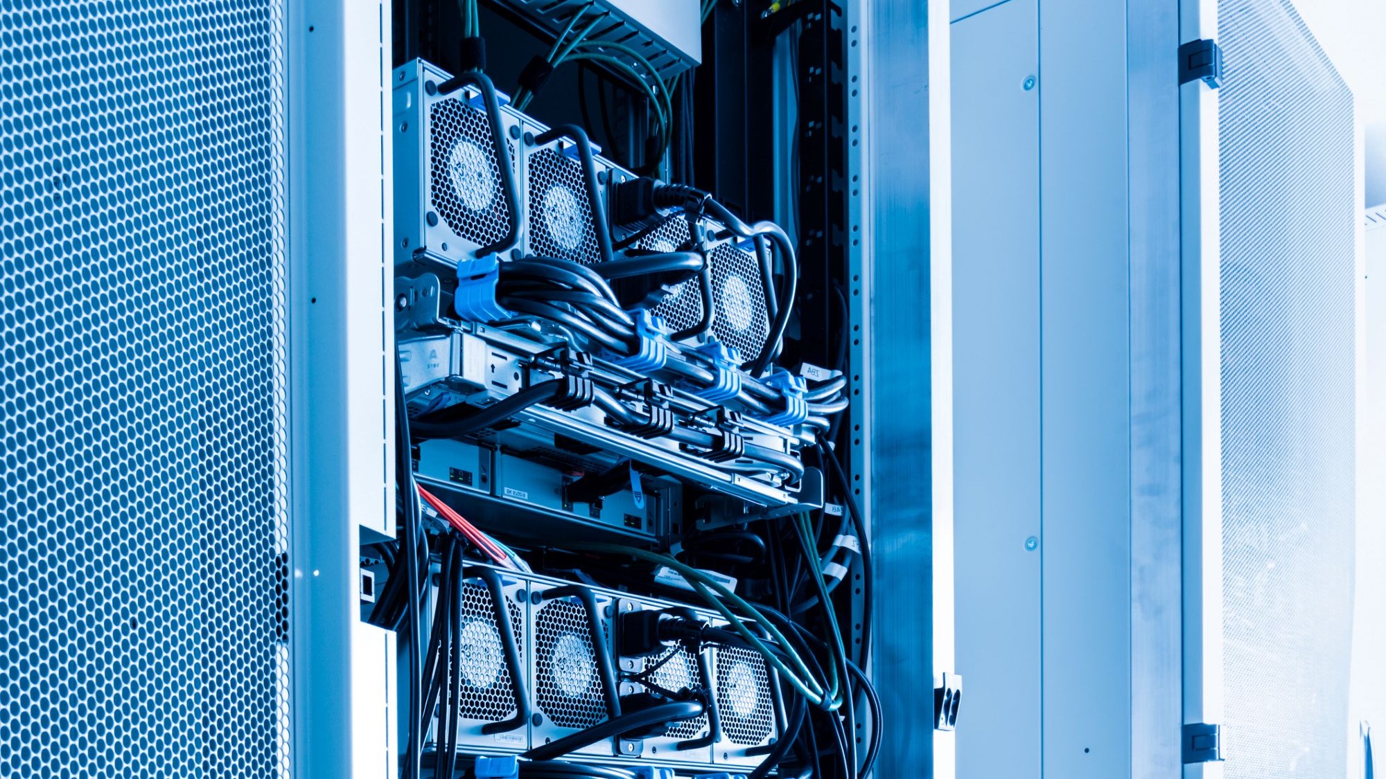 A row of racks with energy supply UPS hardware inside server room